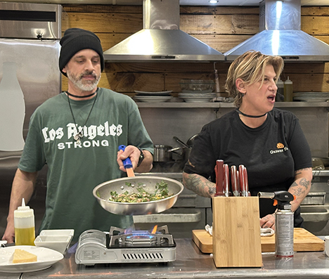 James Cunningham, credited as Chef Jimmy, cooking beside Chef Michele Ragussis at Mohegan Sun in 2025